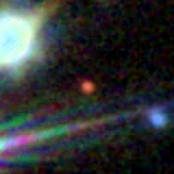 Colour composite: F444W red, F356W green, F277W blue, 3.2 arcsec across, north up