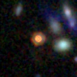 Colour composite: F444W red, F356W green, F277W blue, 3.2 arcsec across, north up