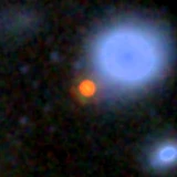 Colour composite: F444W red, F356W green, F277W blue, 3.2 arcsec across, north up
