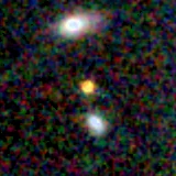 Colour composite: F444W red, F356W green, F277W blue, 3.2 arcsec across, north up