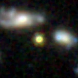 Colour composite: F444W red, F356W green, F277W blue, 3.2 arcsec across, north up