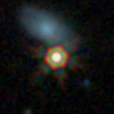 Colour composite: F444W red, F356W green, F277W blue, 3.2 arcsec across, north up
