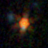 Colour composite: F444W red, F356W green, F277W blue, 3.2 arcsec across, north up
