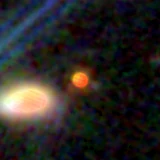 Colour composite: F444W red, F356W green, F277W blue, 3.2 arcsec across, north up