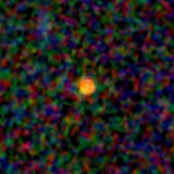 Colour composite: F444W red, F356W green, F277W blue, 3.2 arcsec across, north up