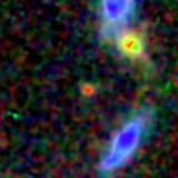 Colour composite: F444W red, F356W green, F277W blue, 3.2 arcsec across, north up