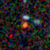 Colour composite: F444W red, F356W green, F277W blue, 3.2 arcsec across, north up