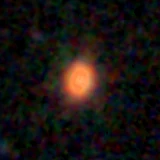 Colour composite: F444W red, F356W green, F277W blue, 3.2 arcsec across, north up