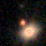 Colour composite: F444W red, F356W green, F277W blue, 3.2 arcsec across, north up