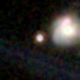 Colour composite: F444W red, F356W green, F277W blue, 3.2 arcsec across, north up