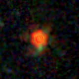 Colour composite: F444W red, F356W green, F277W blue, 3.2 arcsec across, north up