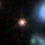 Colour composite: F444W red, F356W green, F277W blue, 3.2 arcsec across, north up