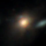 Colour composite: F444W red, F356W green, F277W blue, 3.2 arcsec across, north up