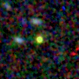 Colour composite: F444W red, F356W green, F277W blue, 3.2 arcsec across, north up