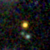 Colour composite: F444W red, F356W green, F277W blue, 3.2 arcsec across, north up
