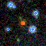 Colour composite: F444W red, F356W green, F277W blue, 3.2 arcsec across, north up