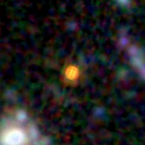 Colour composite: F444W red, F356W green, F277W blue, 3.2 arcsec across, north up