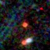 Colour composite: F444W red, F356W green, F277W blue, 3.2 arcsec across, north up