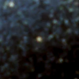 Colour composite: F444W red, F356W green, F277W blue, 3.2 arcsec across, north up