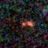 Colour composite: F444W red, F356W green, F277W blue, 3.2 arcsec across, north up