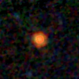 Colour composite: F444W red, F356W green, F277W blue, 3.2 arcsec across, north up