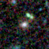 Colour composite: F444W red, F356W green, F277W blue, 3.2 arcsec across, north up
