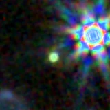 Colour composite: F444W red, F356W green, F277W blue, 3.2 arcsec across, north up
