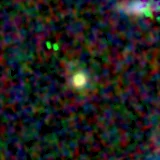 Colour composite: F444W red, F356W green, F277W blue, 3.2 arcsec across, north up