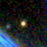 Colour composite: F444W red, F356W green, F277W blue, 3.2 arcsec across, north up