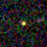 Colour composite: F444W red, F356W green, F277W blue, 3.2 arcsec across, north up