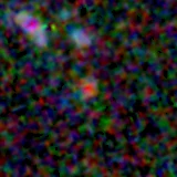 Colour composite: F444W red, F356W green, F277W blue, 3.2 arcsec across, north up