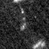F115W image, 3.2 arcsec across, north up