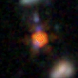 Colour composite: F444W red, F356W green, F277W blue, 3.2 arcsec across, north up