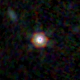 Colour composite: F444W red, F356W green, F277W blue, 3.2 arcsec across, north up
