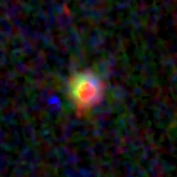 Colour composite: F444W red, F356W green, F277W blue, 3.2 arcsec across, north up
