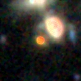 Colour composite: F444W red, F356W green, F277W blue, 3.2 arcsec across, north up