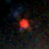 Colour composite: F444W red, F356W green, F277W blue, 3.2 arcsec across, north up