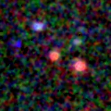 Colour composite: F444W red, F356W green, F277W blue, 3.2 arcsec across, north up