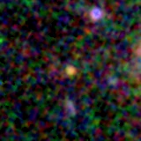 Colour composite: F444W red, F356W green, F277W blue, 3.2 arcsec across, north up