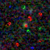 Colour composite: F444W red, F356W green, F277W blue, 3.2 arcsec across, north up
