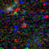 Colour composite: F444W red, F356W green, F277W blue, 3.2 arcsec across, north up
