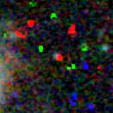Colour composite: F444W red, F356W green, F277W blue, 3.2 arcsec across, north up