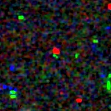 Colour composite: F444W red, F356W green, F277W blue, 3.2 arcsec across, north up