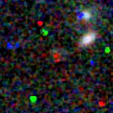 Colour composite: F444W red, F356W green, F277W blue, 3.2 arcsec across, north up