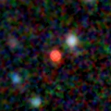Colour composite: F444W red, F356W green, F277W blue, 3.2 arcsec across, north up