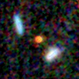 Colour composite: F444W red, F356W green, F277W blue, 3.2 arcsec across, north up