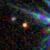 Colour composite: F444W red, F356W green, F277W blue, 3.2 arcsec across, north up