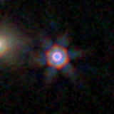 Colour composite: F444W red, F356W green, F277W blue, 3.2 arcsec across, north up