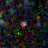 Colour composite: F444W red, F356W green, F277W blue, 3.2 arcsec across, north up