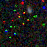 Colour composite: F444W red, F356W green, F277W blue, 3.2 arcsec across, north up